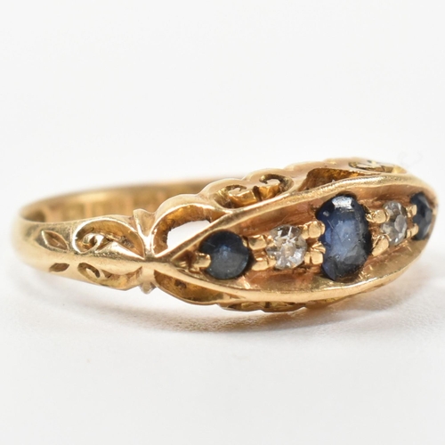 369 - An Edwardian hallmarked 18ct gold, sapphire and diamond boat ring. The ring set with a central oval ... 