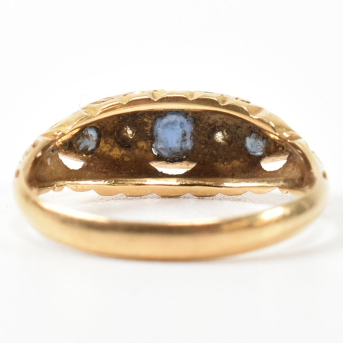 369 - An Edwardian hallmarked 18ct gold, sapphire and diamond boat ring. The ring set with a central oval ... 