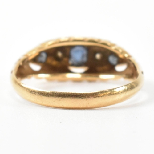 369 - An Edwardian hallmarked 18ct gold, sapphire and diamond boat ring. The ring set with a central oval ... 