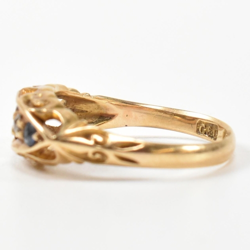 369 - An Edwardian hallmarked 18ct gold, sapphire and diamond boat ring. The ring set with a central oval ... 