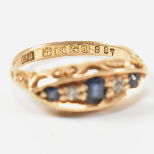 369 - An Edwardian hallmarked 18ct gold, sapphire and diamond boat ring. The ring set with a central oval ... 