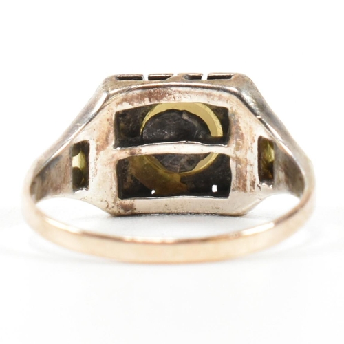 372 - A 9ct gold, pearl and marcasite ring. The Art Deco style ring having a central pearl set in a marcas... 