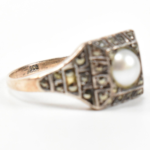 372 - A 9ct gold, pearl and marcasite ring. The Art Deco style ring having a central pearl set in a marcas... 