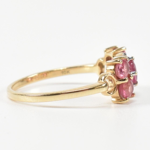 377 - A hallmarked 9ct gold, pink sapphire and diamond ring. The ring having a central oval cut pink sapph... 