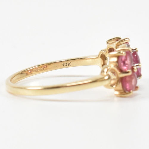 377 - A hallmarked 9ct gold, pink sapphire and diamond ring. The ring having a central oval cut pink sapph... 