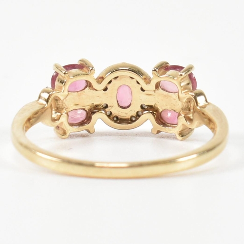 377 - A hallmarked 9ct gold, pink sapphire and diamond ring. The ring having a central oval cut pink sapph... 