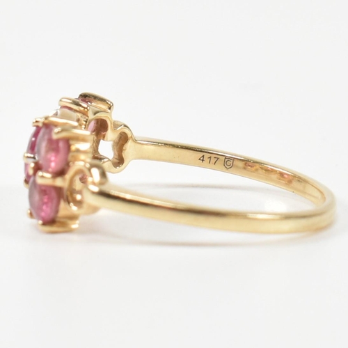 377 - A hallmarked 9ct gold, pink sapphire and diamond ring. The ring having a central oval cut pink sapph... 