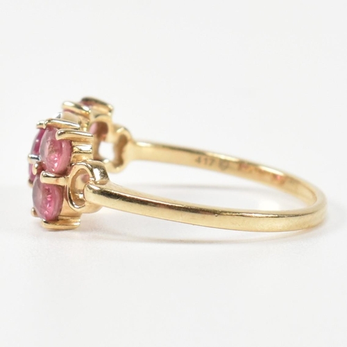 377 - A hallmarked 9ct gold, pink sapphire and diamond ring. The ring having a central oval cut pink sapph... 