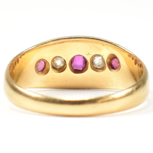 38 - A Victorian hallmarked 18ct gold ruby and diamond gypsy ring. The ring set with three rubies and two... 