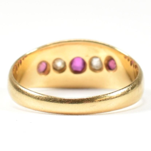 38 - A Victorian hallmarked 18ct gold ruby and diamond gypsy ring. The ring set with three rubies and two... 