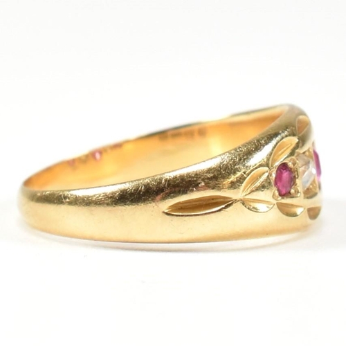 38 - A Victorian hallmarked 18ct gold ruby and diamond gypsy ring. The ring set with three rubies and two... 