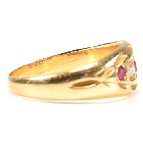 38 - A Victorian hallmarked 18ct gold ruby and diamond gypsy ring. The ring set with three rubies and two... 