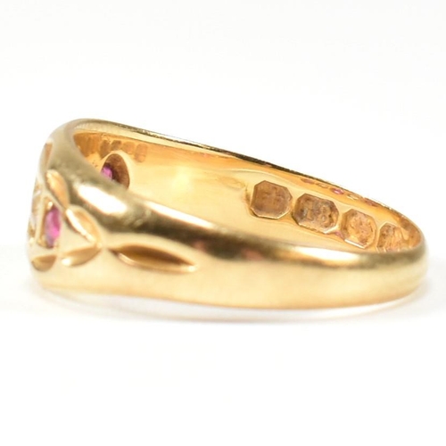 38 - A Victorian hallmarked 18ct gold ruby and diamond gypsy ring. The ring set with three rubies and two... 