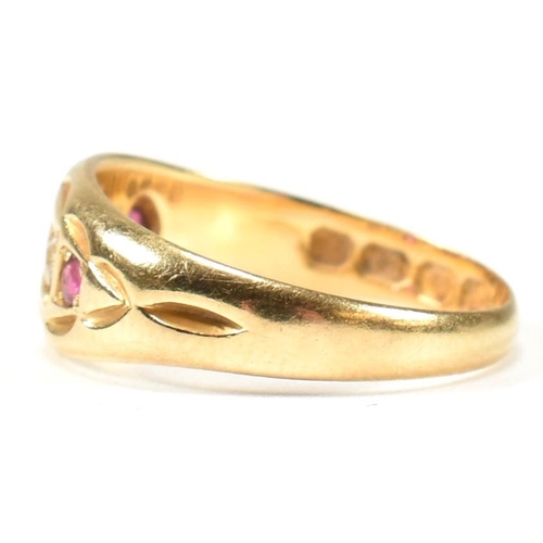 38 - A Victorian hallmarked 18ct gold ruby and diamond gypsy ring. The ring set with three rubies and two... 