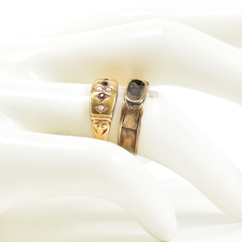 384 - A Victorian hallmarked 15ct gold and gem set ring and a gold band ring. The rings to include a Victo... 