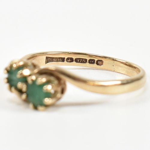 385 - A hallmarked 9ct gold and emerald ring and a rose gold, emerald and sapphire ring. The rings to incl... 