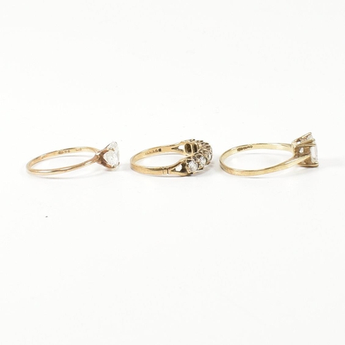 387 - Three hallmarked 9ct gold and CZ rings. The rings to include a hallmarked 9ct gold and CZ half hoop ... 