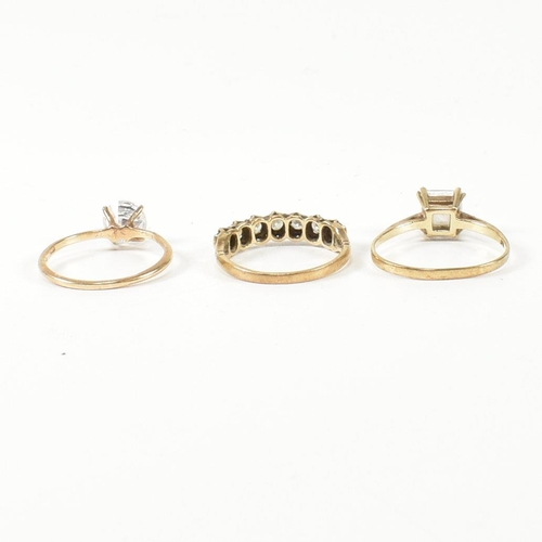 387 - Three hallmarked 9ct gold and CZ rings. The rings to include a hallmarked 9ct gold and CZ half hoop ... 