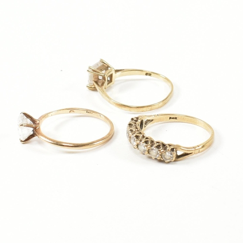 387 - Three hallmarked 9ct gold and CZ rings. The rings to include a hallmarked 9ct gold and CZ half hoop ... 