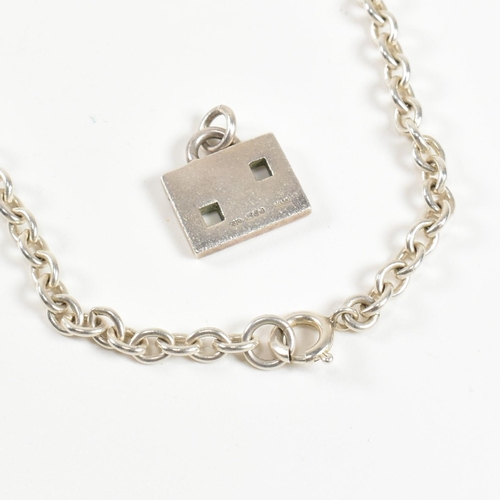 394 - A hallmarked silver Gucci necklace pendant and a silver chain necklace. The lot to include a hallmar... 