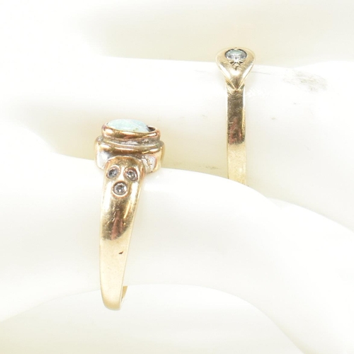 395 - Two hallmarked 9ct gold, diamond and opal rings. The rings to include a hallmarked 9ct gold ring hav... 