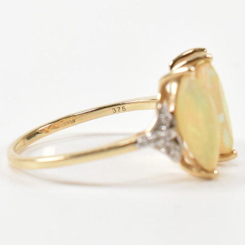 396 - A hallmarked 9ct gold and opal three stone ring. The ring set with three marquise cut opals to shoul... 