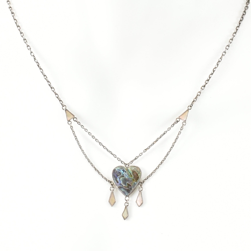 405 - An Arts and Crafts style sterling silver and abalone pendant necklace. The necklace strung with an a... 