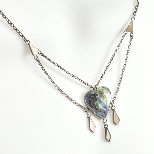 405 - An Arts and Crafts style sterling silver and abalone pendant necklace. The necklace strung with an a... 