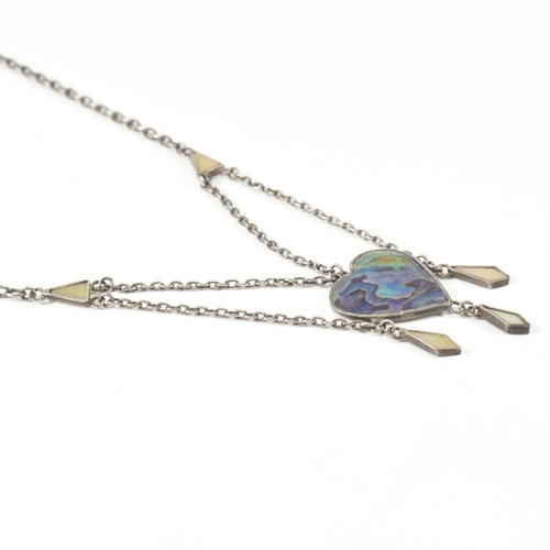 405 - An Arts and Crafts style sterling silver and abalone pendant necklace. The necklace strung with an a... 