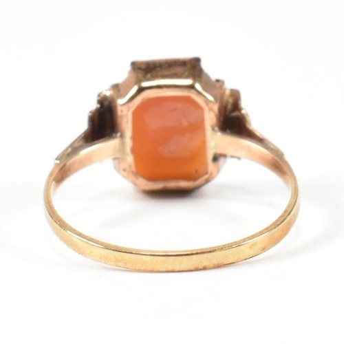 408 - A 9ct gold cameo ring. The 9ct gold ring set with a cameo featuring the profile of a woman's face to... 