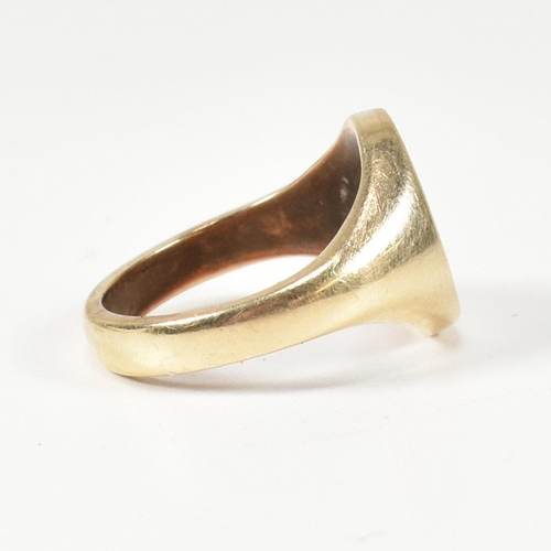 409 - A 9ct gold signet ring with initial monogram. The ring with central roundel cartouche having engrave... 