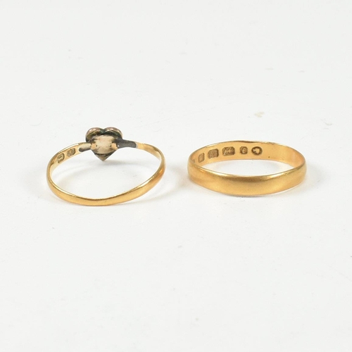 412 - A hallmarked 22ct gold band ring and a hallmarked 14ct gold and seed pearl heart ring. The Victorian... 