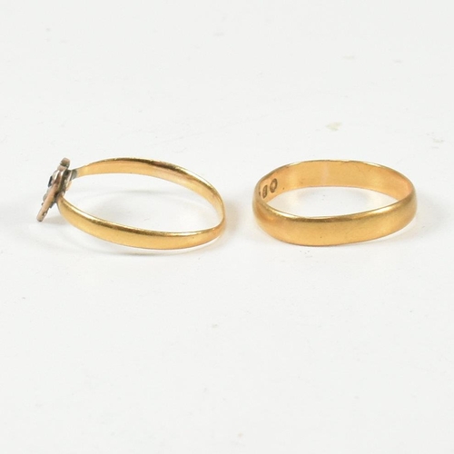 412 - A hallmarked 22ct gold band ring and a hallmarked 14ct gold and seed pearl heart ring. The Victorian... 