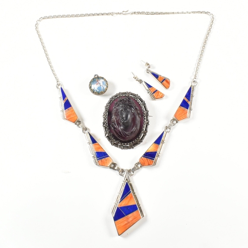 416 - A signed Navajo silver and gem set necklace and earring suite together with a carved paste cameo and... 