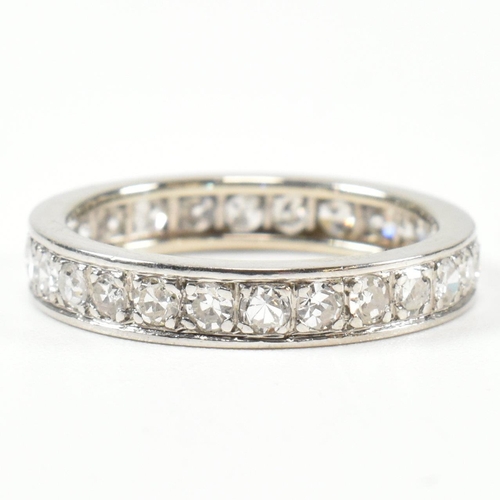 420 - An 18ct white gold and diamond eternity ring. The full eternity ring set all the way round with roun... 