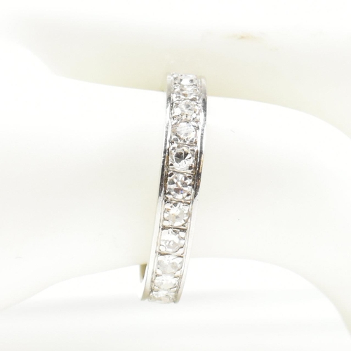 420 - An 18ct white gold and diamond eternity ring. The full eternity ring set all the way round with roun... 