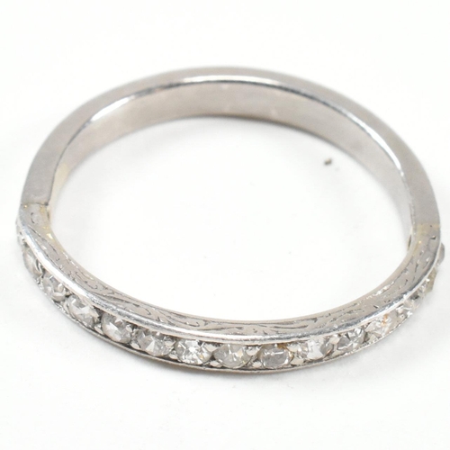 422 - An 18ct white gold and diamond half eternity ring. The half eternity ring set with round brilliant c... 