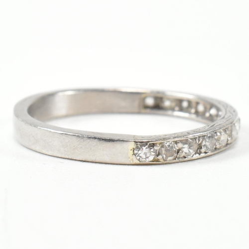 422 - An 18ct white gold and diamond half eternity ring. The half eternity ring set with round brilliant c... 