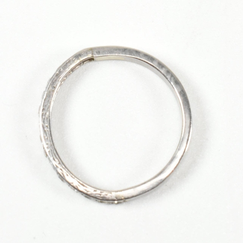 422 - An 18ct white gold and diamond half eternity ring. The half eternity ring set with round brilliant c... 