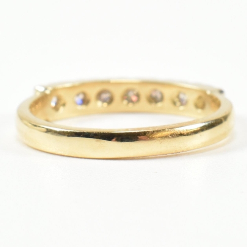 424 - An 18ct gold and diamond half hoop ring. The gold ring set with seven round brilliant cut diamonds i... 