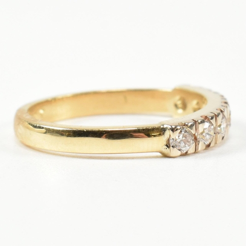 424 - An 18ct gold and diamond half hoop ring. The gold ring set with seven round brilliant cut diamonds i... 