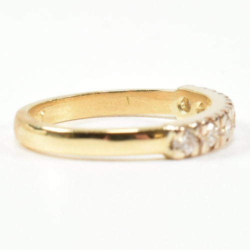 424 - An 18ct gold and diamond half hoop ring. The gold ring set with seven round brilliant cut diamonds i... 