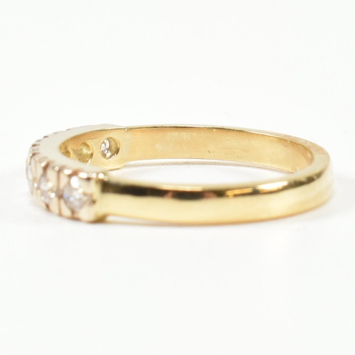 424 - An 18ct gold and diamond half hoop ring. The gold ring set with seven round brilliant cut diamonds i... 