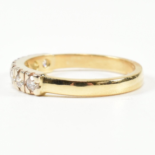 424 - An 18ct gold and diamond half hoop ring. The gold ring set with seven round brilliant cut diamonds i... 