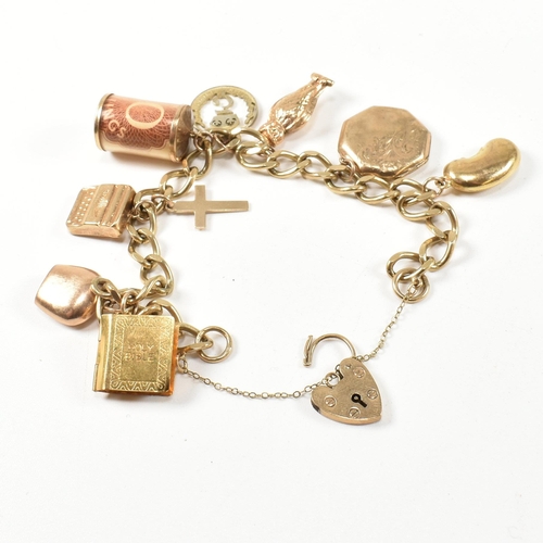 43 - A hallmarked 9ct gold charm bracelet. The charm bracelet having nine gold charms strung on a 9ct gol... 