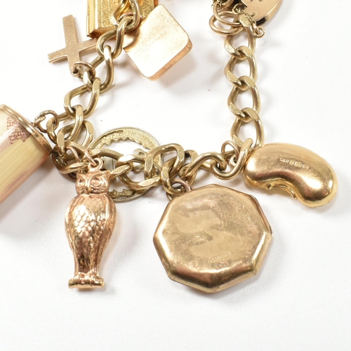 43 - A hallmarked 9ct gold charm bracelet. The charm bracelet having nine gold charms strung on a 9ct gol... 