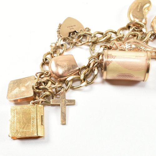 43 - A hallmarked 9ct gold charm bracelet. The charm bracelet having nine gold charms strung on a 9ct gol... 