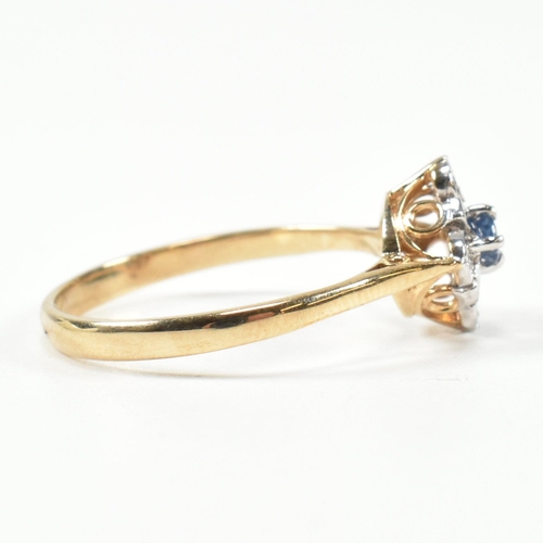 431 - A hallmarked 9ct gold, sapphire and diamond cluster ring. The ring set with a central round cut sapp... 