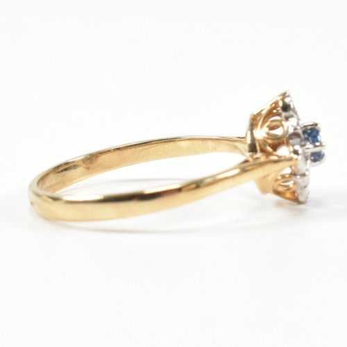 431 - A hallmarked 9ct gold, sapphire and diamond cluster ring. The ring set with a central round cut sapp... 