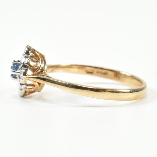 431 - A hallmarked 9ct gold, sapphire and diamond cluster ring. The ring set with a central round cut sapp... 